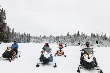 Moment Team on snowmobiles